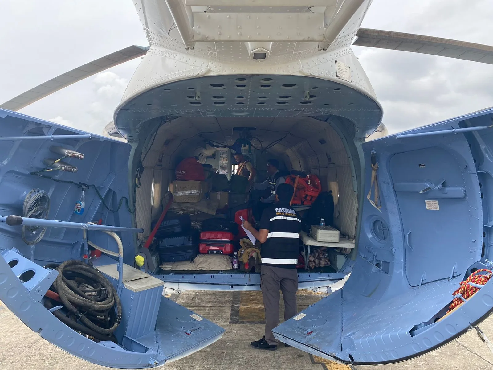 Cargo and baggage loaded in the Mi-8 rear cabin during a customs check